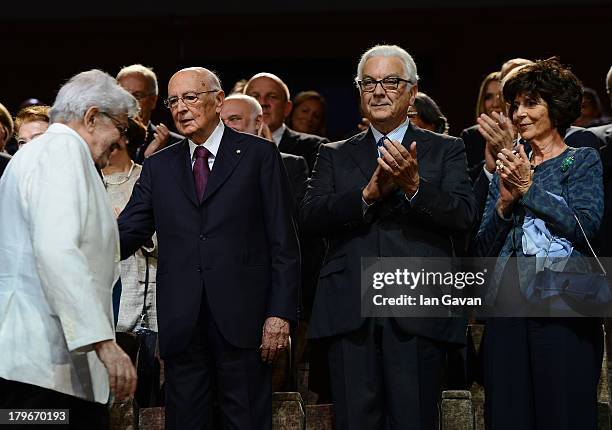 Film Director Ettore Scola , arrives to greet his wife Italian President Giorgio Napolitano and President of La Biennale Paolo Baratta before...