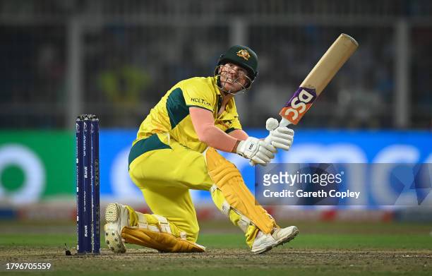 David Warner of Australia hits a six during the ICC Men's Cricket World Cup India 2023 Semi Final match between South Africa and Australia at Eden...