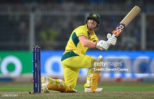 David Warner of Australia hits a six during the ICC Men's Cricket World Cup India 2023 Semi Final match between South Africa and Australia at Eden...