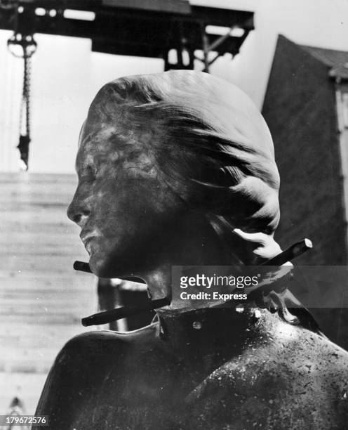 New head is fitted to the famous little mermaid of Copenhagen, after vandals stole it , 5/26/194.