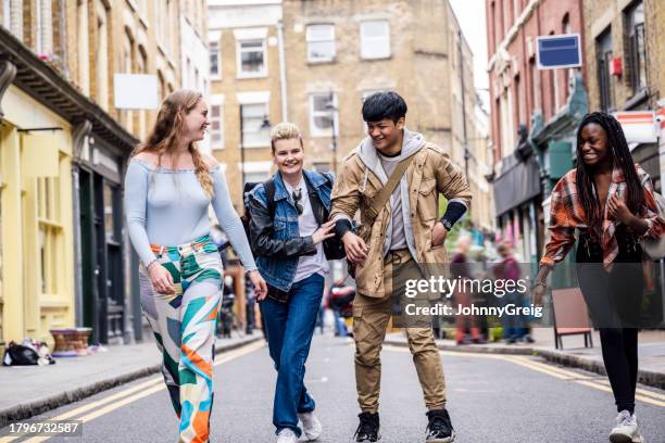 young friends mucking about having fun together - brick lane inner london stock pictures, royalty-free photos & images