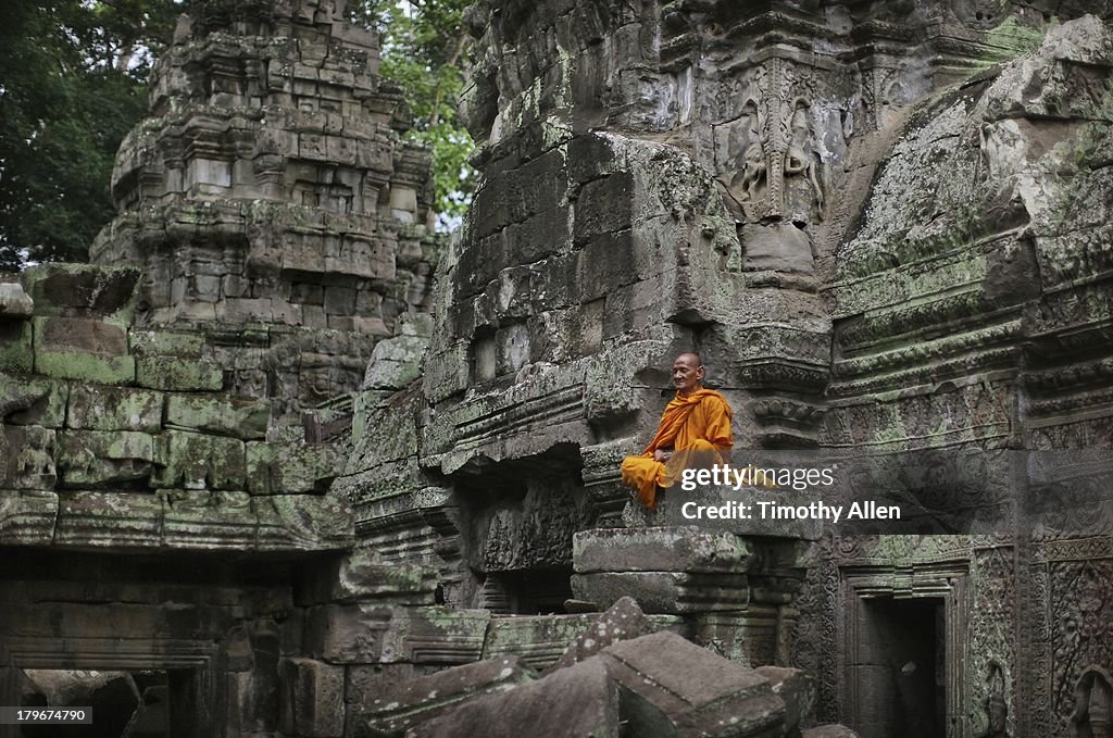 Buddhist monk meditates at Angkor Wat temple
