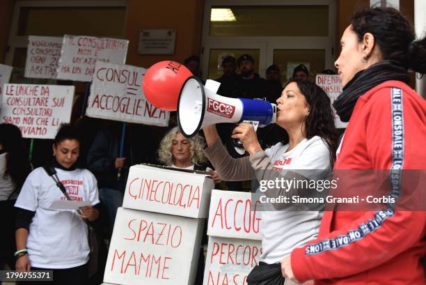 Women and young people with placards and T-shirts reading "do not touch family counseling centers" symbolically occupy the family counseling center...