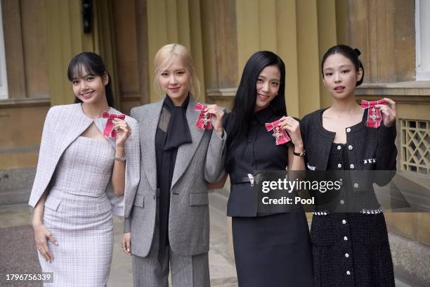 Lisa , Rose , Jisoo Kim and Jennie Kim, from the K-Pop band Blackpink pose with their Honorary MBEs , awarded to them in recognition of the band's...