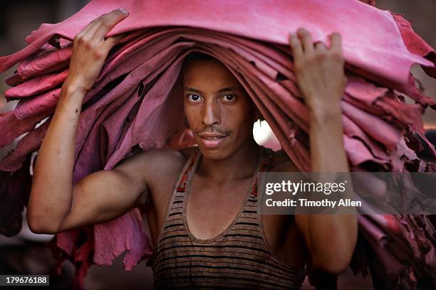 fez tanner carries red leathers portrait - leather vest stock pictures, royalty-free photos & images