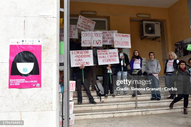 Women and young people with placards and T-shirts reading "do not touch family counseling centers" symbolically occupy the family counseling center...