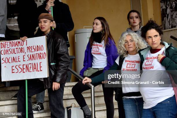 Women and young people with placards and T-shirts reading "do not touch family counseling centers" symbolically occupy the family counseling center...