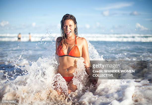 australian girl coming out of the water at beach - bondi stock pictures, royalty-free photos & images