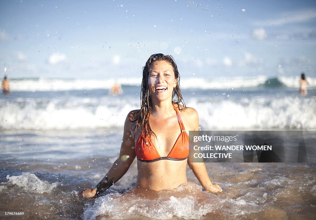Australian girl coming out of the water at beach