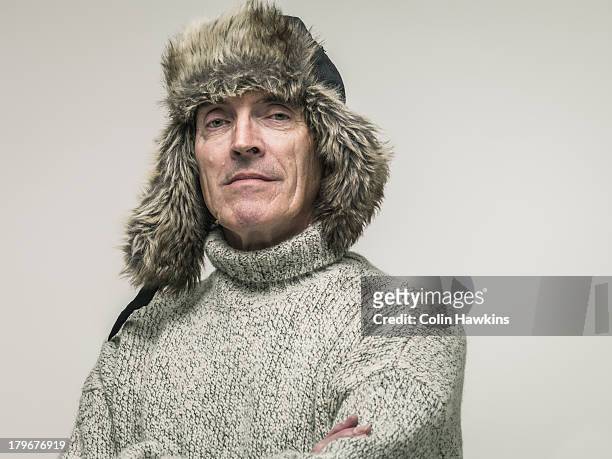 elderly man in warm winter clothing - fur hat stock pictures, royalty-free photos & images