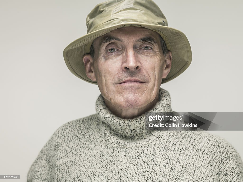 Elderly male in outdoor clothing