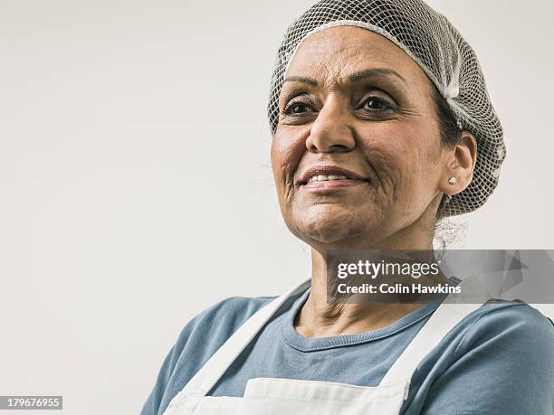 senior female wearing hygiene clothing - woman chef stock pictures, royalty-free photos & images