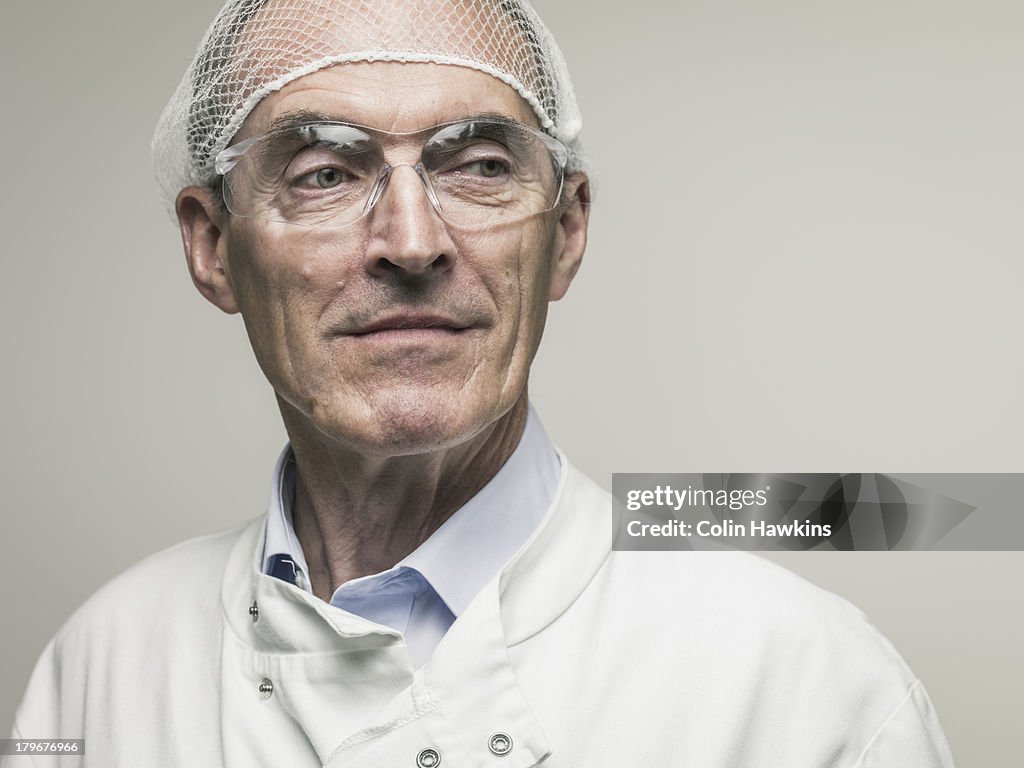 Elderly male in protective clothing