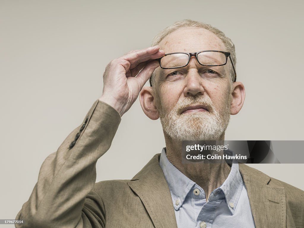 Elderly man looking with glasses