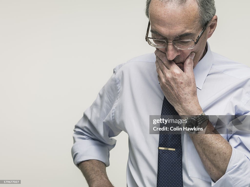 Elderly business man thinking