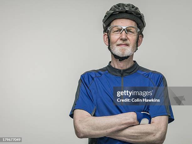 elderly male cyclist - cycling helmet stock pictures, royalty-free photos & images