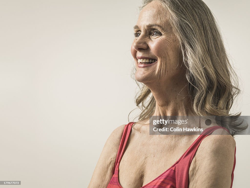 Happy senior woman wearing sports top