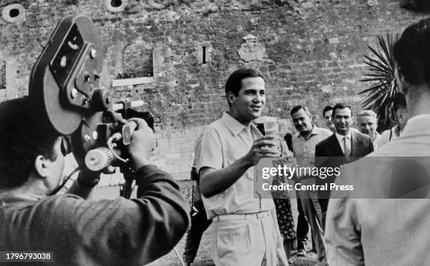 Greek Royal Constantine II of Greece raises a glass to celebrate the birth of his first daughter, Princess Alexia of Greece and Denmark, at Mon...