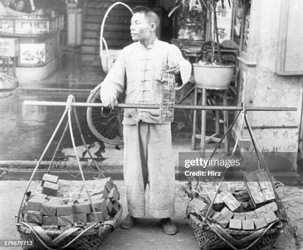 Chinese man sells matches on the streets on Hong Kong, China.