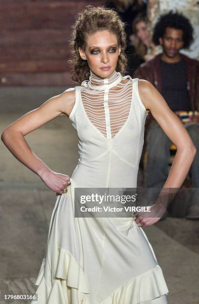 Chrystele Saint Louis Augustin walks the runway during the Catherine Malandrino Ready to Wear Fall/Winter 2002-2003 fashion show as part of the New...