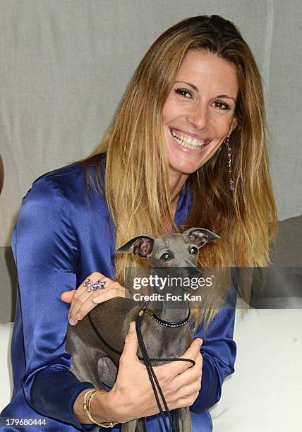 Former Miss France 1998/ TV presenter Sophie Thalmann and dog Helixir attend the Duo Delice Dog Food Launch Party at 6 Mandel on September 6, 2013 in...