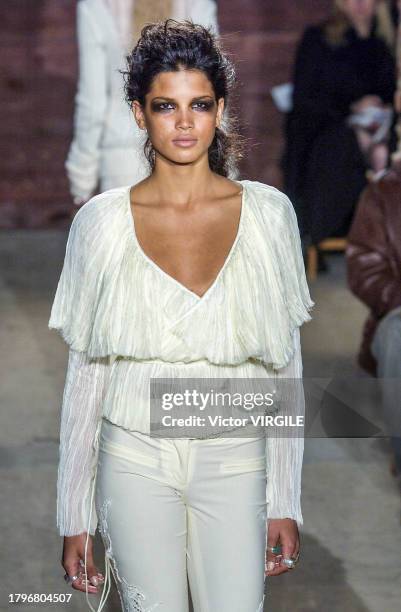 Raica Oliveira walks the runway during the Catherine Malandrino Ready to Wear Fall/Winter 2002-2003 fashion show as part of the New York Fashion Week...