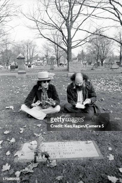 Musician Bob Dylan and poet Allen Ginsberg are photographed at Jack Keuroac's grave during the Rolling Thunder Revue in October 1975 in Lowell,...