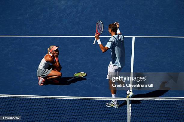 Max Mirnyi of Belarus and Andrea Hlavackova of Czech Republic celebrate winning their mixed doubles final match against Abigail Spears of the United...