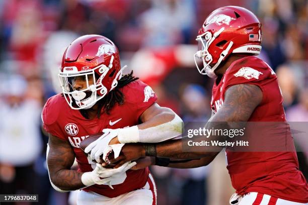 Green takes the hand off from K.J. Jefferson of the Arkansas Razorbacks during the game against the Auburn Tigers at Donald W. Reynolds Razorback...