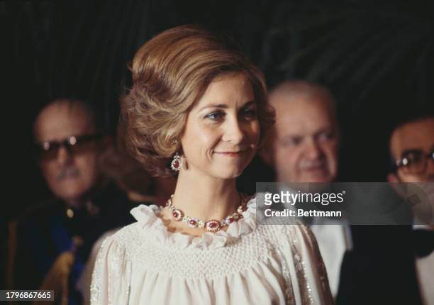 Queen Sofia of Spain wearing a ruby necklace and earrings at an event in 1976.