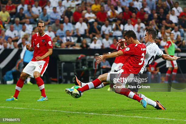 Miroslav Klose of Germany scores his team's first goal against Aleksandr Dragovic of Austria during the FIFA 2014 World Cup Group C qualifying match...