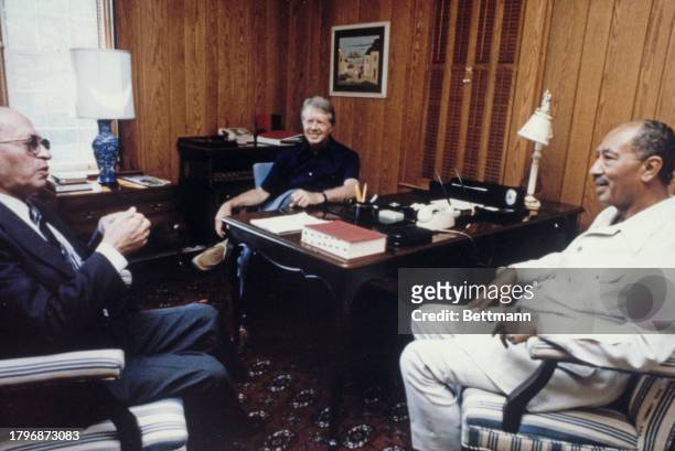 Israeli Prime Minister Menachem Begin , US President Jimmy Carter and Egyptian President Anwar Al Sadat during a meeting at Camp David in Maryland,...