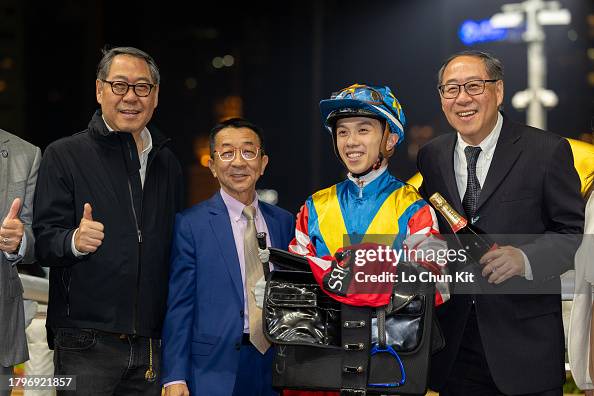 Greg Chung Racing Jockey Angus Chung Yik-lai and trainer Me Tsui Yu-sak pose for photo ...