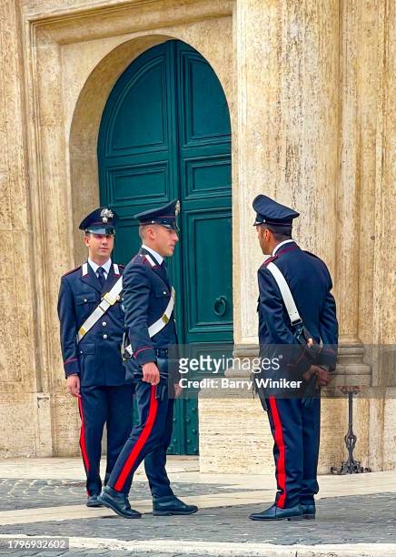 carabinieri standing on street, rome - gray belt stock pictures, royalty-free photos & images