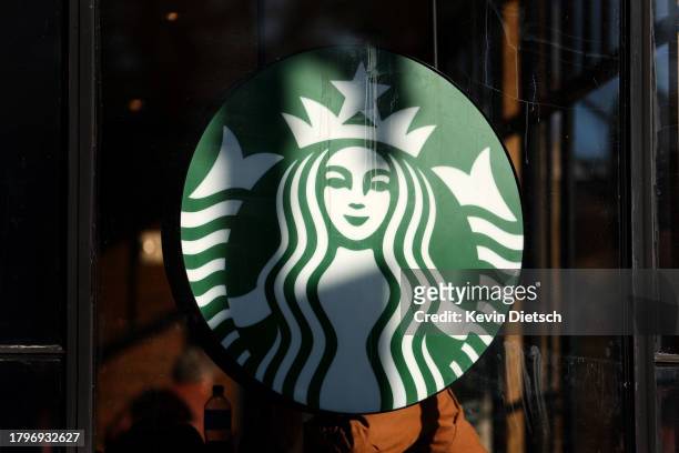 Starbucks logo is seen as members and supporters of Starbucks Workers United protest outside of a Starbucks store in Dupont Circle on November 16,...