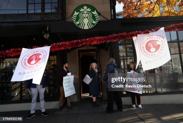Members and supporters of Starbucks Workers United protest outside of a Starbucks store in Dupont Circle on November 16, 2023 in Washington, DC. The...
