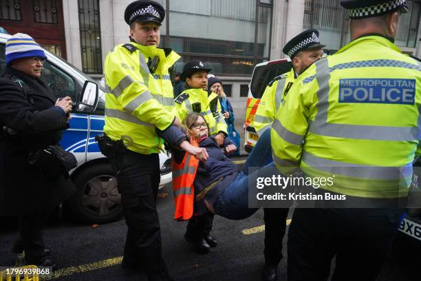 Just Stop Oil activist is arrested for slow walking in the road under section 7 of the Public Order Act on the 21st of November 2023, London, United...