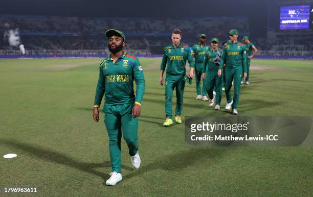 Temba Bavuma of South Africa leads his team off the field following defeat in the ICC Men's Cricket World Cup India 2023 Semi Final match between...
