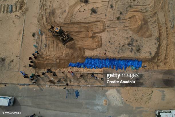 An aerial view of the burial of 111 Palestinians who died due to Israeli attacks to mass graves in Khan Yunis, Gaza on November 22, 2023.