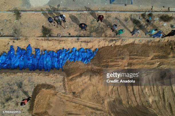 An aerial view of the burial of 111 Palestinians who died due to Israeli attacks to mass graves in Khan Yunis, Gaza on November 22, 2023.