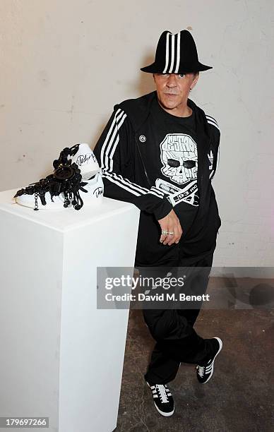 Artist Judy Blame poses with his design at a private view of the Platform Six exhibition with adidas Originals Stan Smith auction in support of...