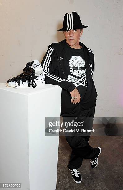 Artist Judy Blame poses with his design at a private view of the Platform Six exhibition with adidas Originals Stan Smith auction in support of...