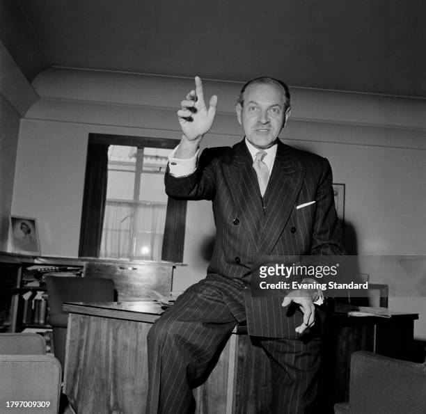 Businessman Jack Bowthorpe gesturing in his office, May 27th 1957.