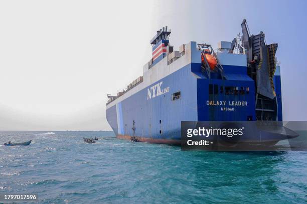 Picture taken during an organised tour by Yemen's Huthi rebels on November 22, 2023 shows the Galaxy Leader cargo ship, seized by Huthi fighters two...