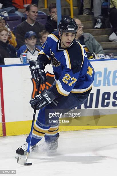 Bryce Salvador of the St. Louis Blues skates with the puck against the Ottawa Senators at the Savvis Center on December 5, 2002 in St. Louis,...