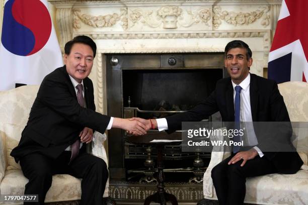Britain's Prime Minister Rishi Sunak, right, shakes hands with President of South Korea Yoon Suk Yeol inside 10 Downing Street on November 22, 2023...