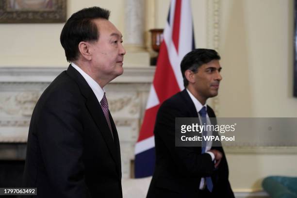 Britain's Prime Minister Rishi Sunak, right, and President of South Korea Yoon Suk Yeol walk to their meeting inside 10 Downing Street on November...