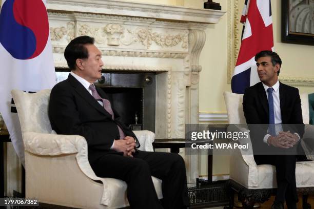 Britain's Prime Minister Rishi Sunak listens to the President of South Korea Yoon Suk Yeol make some remarks to the media at the start of their...