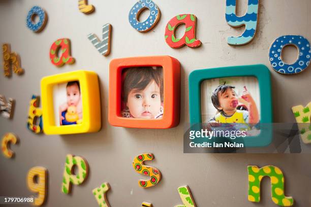 childhood photographs and picture on wall - fridge magnet stock pictures, royalty-free photos & images