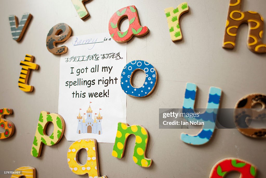 Letters and school certificate on wall